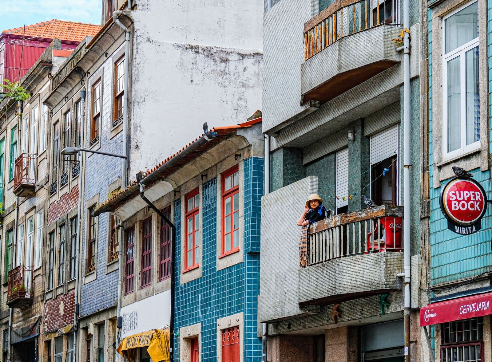 Pastel-colored residential buildings with balconies in Porto
