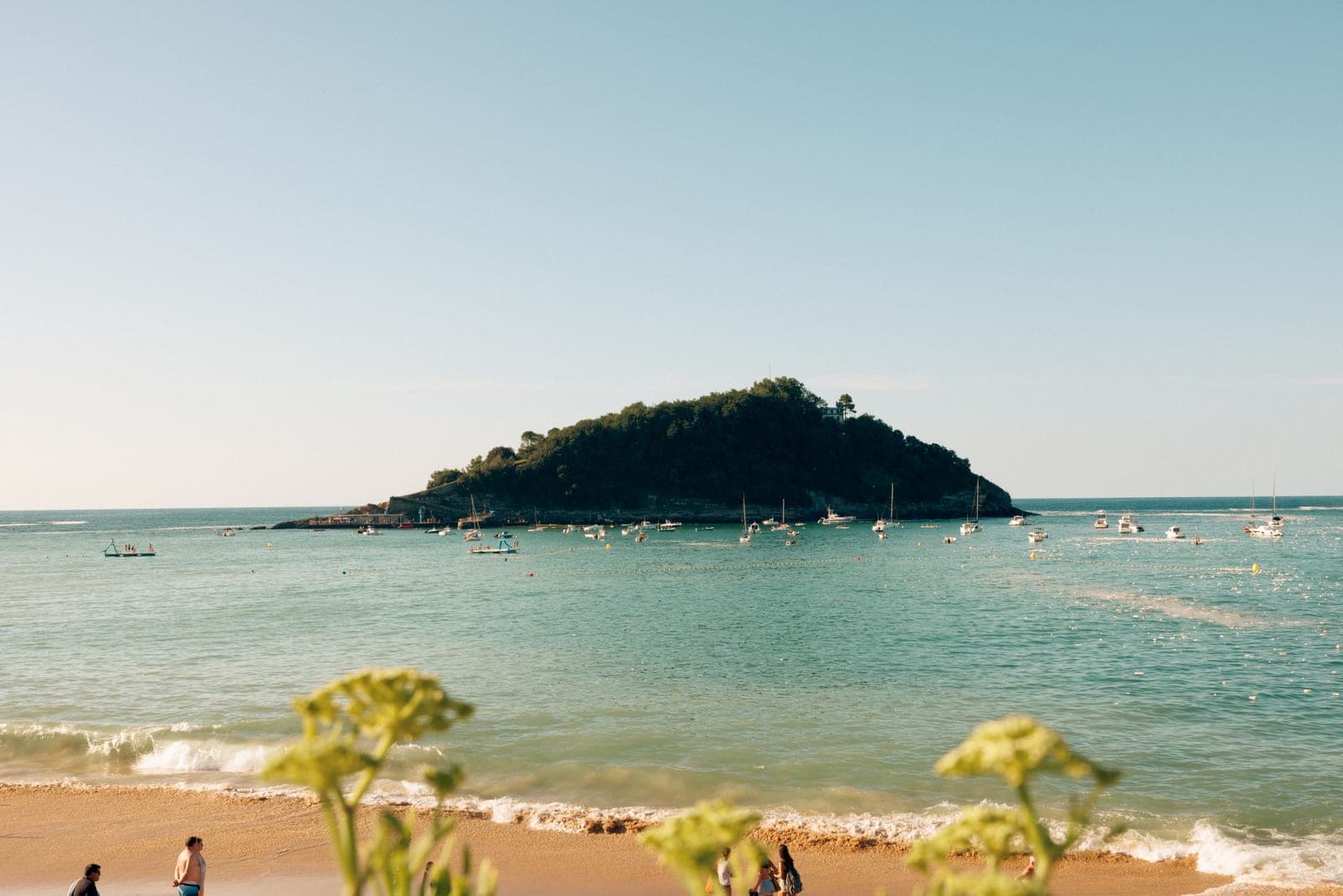 Beautiful summer beach scene with views of Isla de Santa Clara, San Sebastian, Spain.