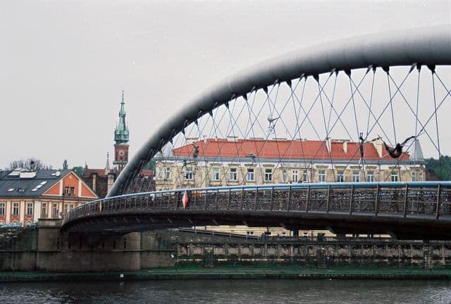 Kładka Bernatka Bridge spans the Vistula River in Kraków.