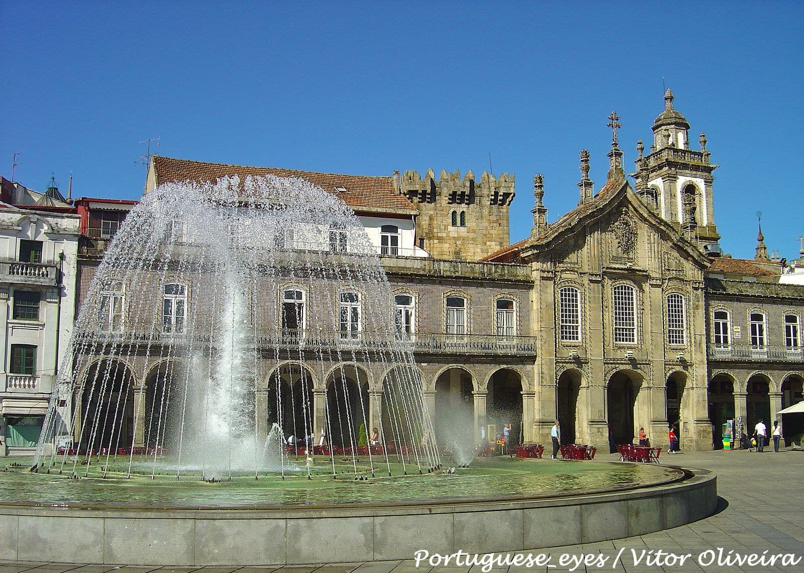 Central arcaded Praça da República in Braga historic center with illuminated fountain