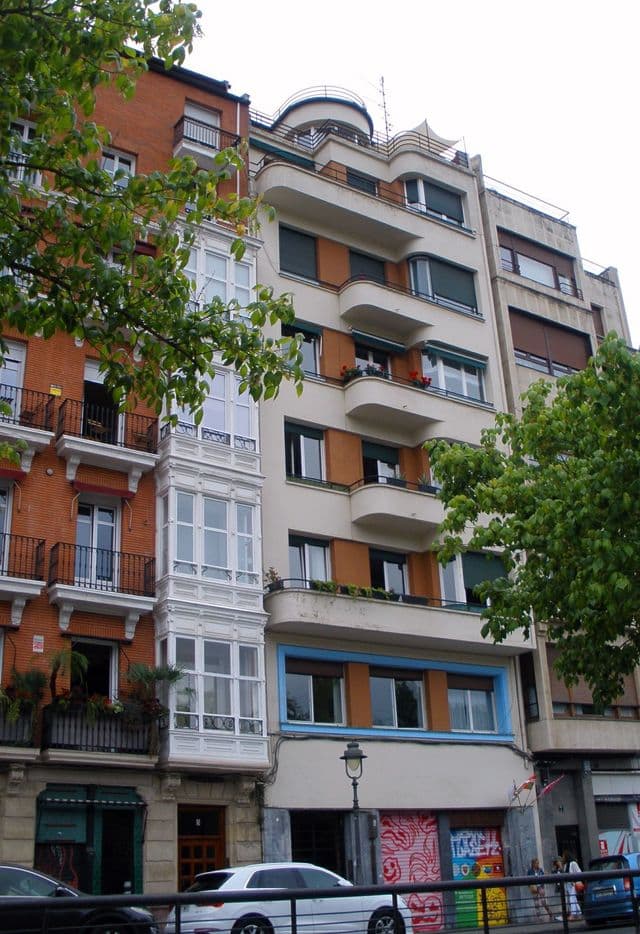 Traditional iron balconies and Belle Époque facade on Calle Ripa in Bilbao